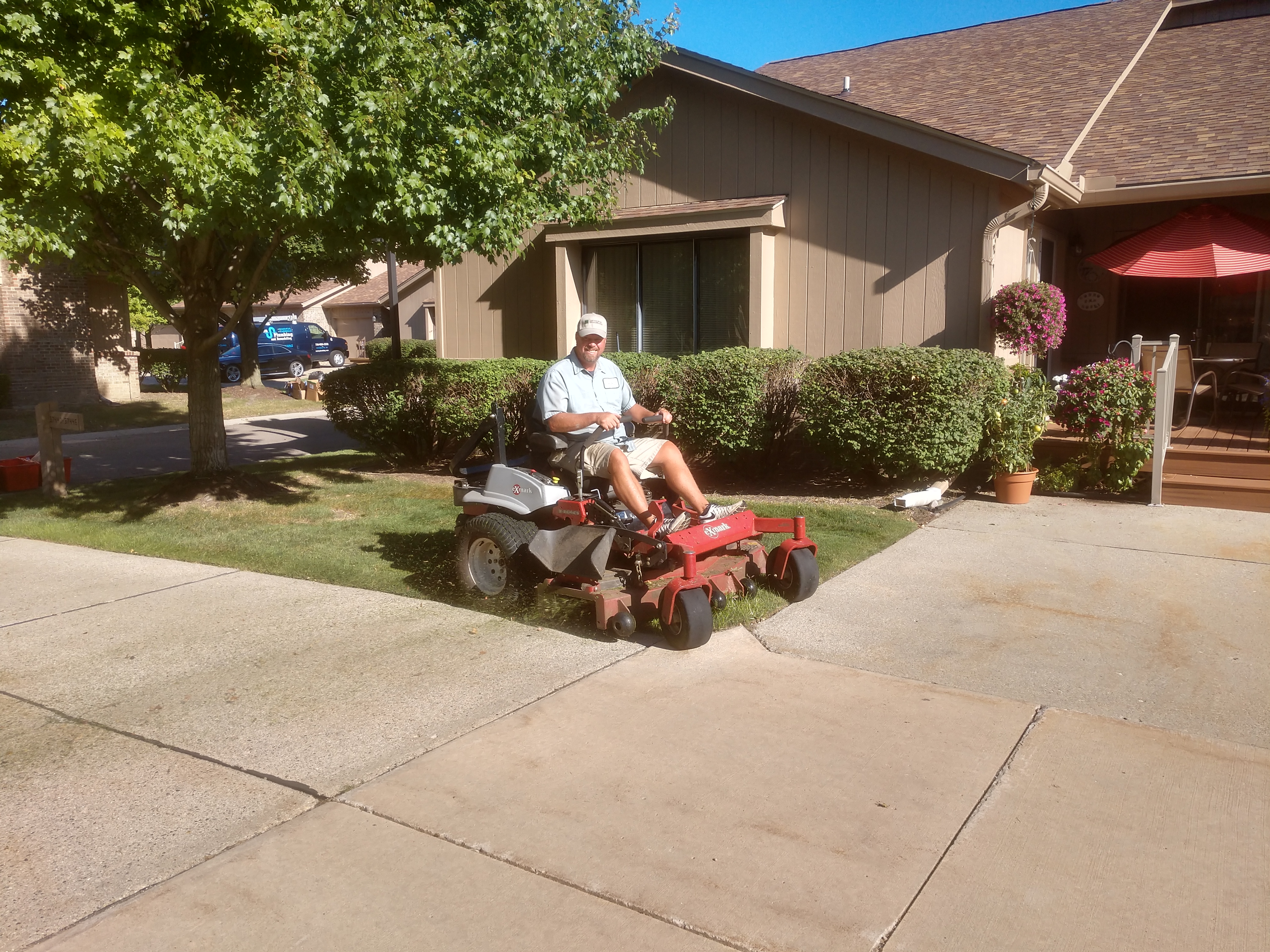 Lawn crew leader on a mower