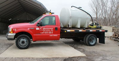 Spray truck by salt bins